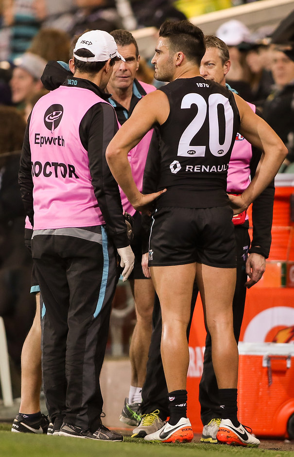 AFL 2016 Rd 21 - Port Adelaide v Melbourne ADELAIDE, AUSTRALIA - AUGUST 13: Chad Wingard of the Power with medical staff after injuring his hamstring during the 2016 AFL Round 21 match between Port Adelaide Power and the Melbourne Demons at the Adelaide Oval on August 13, 2016 in Adelaide, Australia. (Photo by AFL Media)